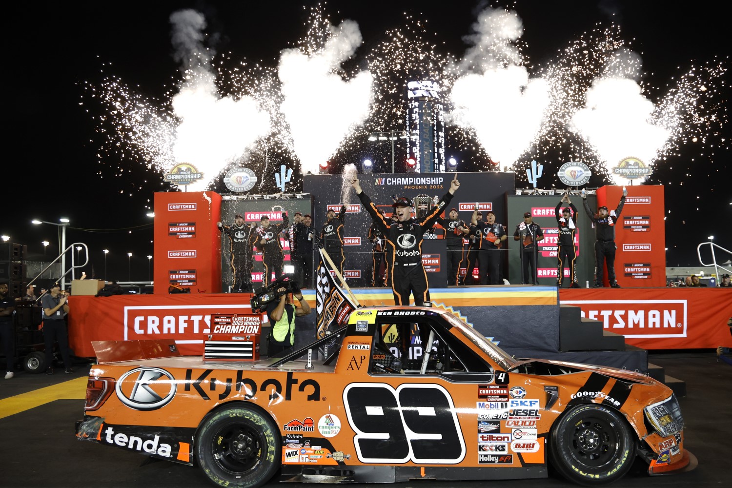Ben Rhodes, driver of the #99 Kubota Ford, celebrates in victory lane after winning the 2023 NASCAR Craftsman Truck Series Championship, finishing first of the Championship 4 drivers in NASCAR Craftsman Truck Series Craftsman 150 at Phoenix Raceway on November 03, 2023 in Avondale, Arizona. (Photo by Chris Graythen/Getty Images)