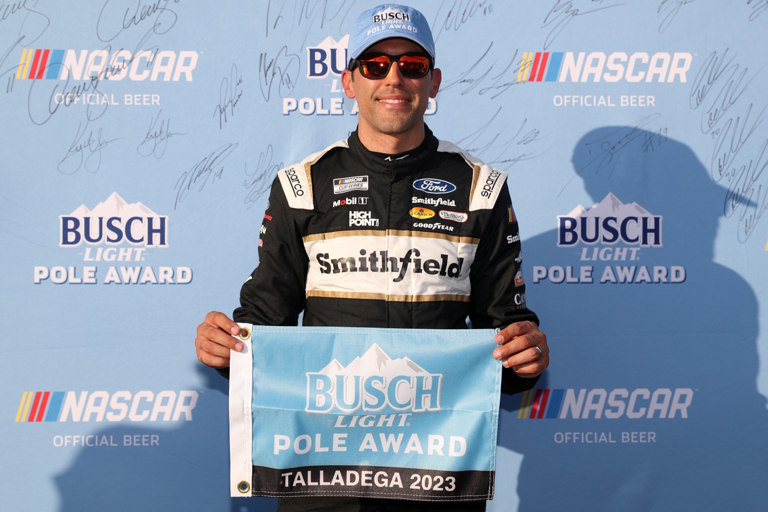 Aric Almirola, driver of the #10 Smithfield Ford, poses for photos after winning the pole award during qualifying for the NASCAR Cup Series YellaWood 500 at Talladega Superspeedway on September 30, 2023 in Talladega, Alabama. (Photo by Meg Oliphant/Getty Images)