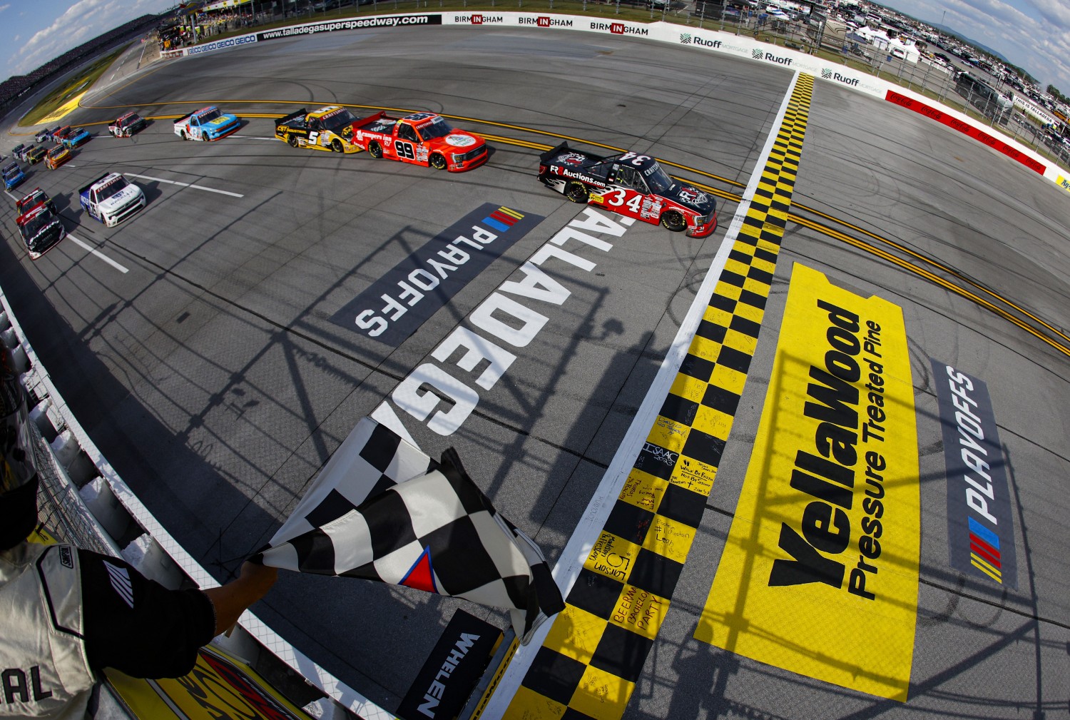 Brett Moffitt, driver of the #34 Fr8Auctions Ford, takes the checkered flag to win the NASCAR Craftsman Truck Series Love's RV Stop 250 at Talladega Superspeedway on September 30, 2023 in Talladega, Alabama. (Photo by Sean Gardner/Getty Images)