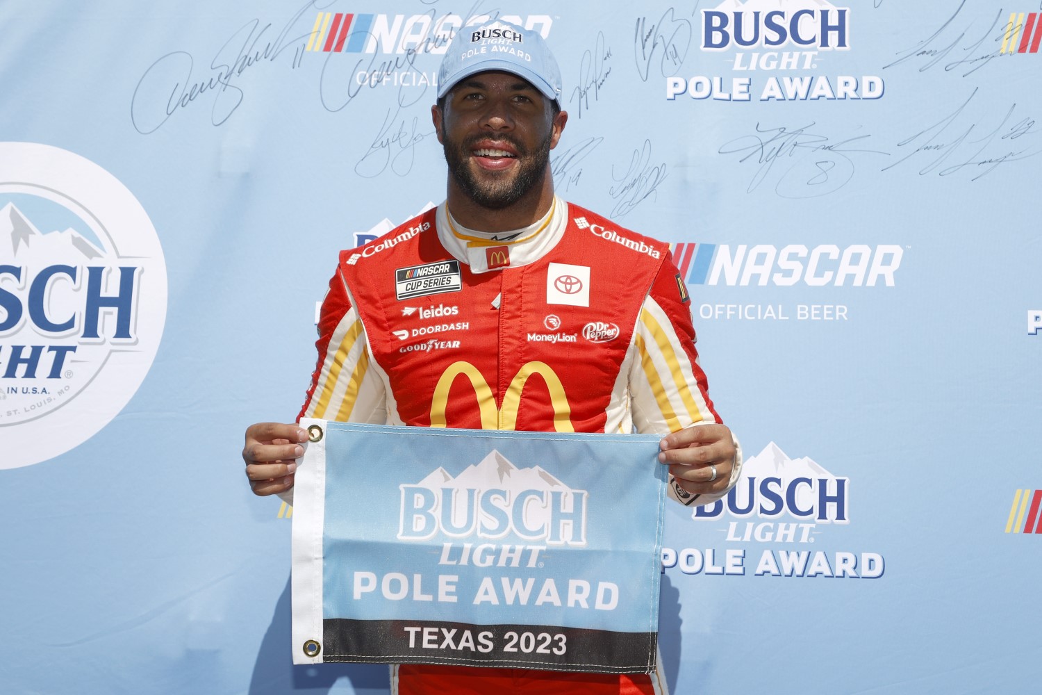 Bubba Wallace, driver of the #23 McDonald's Toyota, poses for photos after winning the pole award during qualifying for the NASCAR Cup Series Autotrader EchoPark Automotive 400 at Texas Motor Speedway on September 23, 2023 in Fort Worth, Texas. (Photo by Chris Graythen/Getty Images)