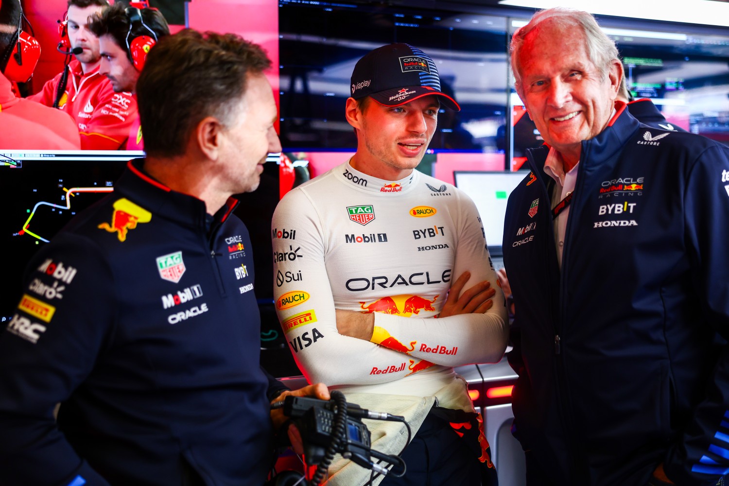 Oracle Red Bull Racing Team Principal Christian Horner, Max Verstappen of the Netherlands and Oracle Red Bull Racing and Oracle Red Bull Racing Team Consultant Dr Helmut Marko talk in the garage during qualifying ahead of the F1 Grand Prix of Australia at Albert Park Circuit on March 23, 2024 in Melbourne, Australia. (Photo by Mark Thompson/Getty Images)