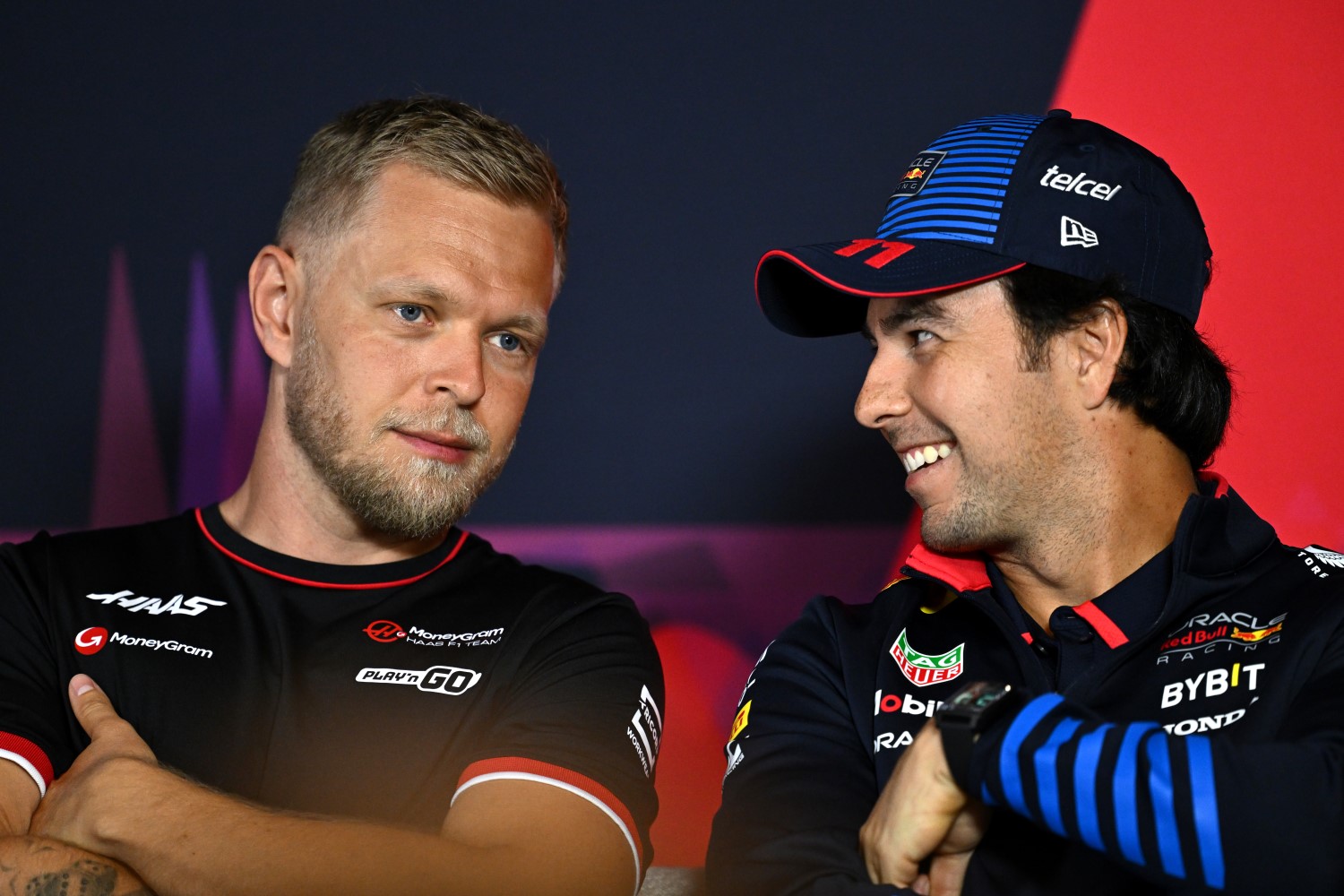 Kevin Magnussen of Denmark and Haas F1 and Sergio Perez of Mexico and Oracle Red Bull Racing talk in the Drivers Press Conference during previews ahead of the F1 Grand Prix of Australia at Albert Park Circuit on March 21, 2024 in Melbourne, Australia. (Photo by Quinn Rooney/Getty Images) // Getty Images / Red Bull Content Pool