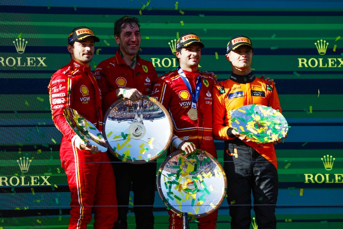 Charles Leclerc, Scuderia Ferrari, 2nd position, Carlos Sainz, Scuderia Ferrari, 1st position, and Lando Norris, McLaren F1 Team, 3rd position, on the podium during the Australian GP at Melbourne Grand Prix Circuit on Sunday March 24, 2024 in Melbourne, Australia. (Photo by Zak Mauger / LAT Images)