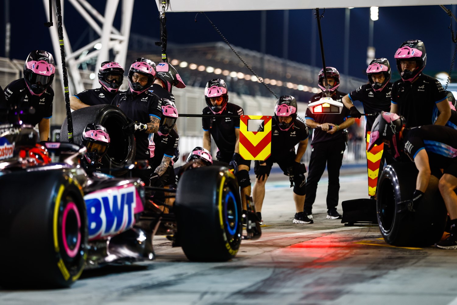 The Alpine pit crew prepares for a pit stop on the car of Esteban Ocon, Alpine A524 during the Pre-Season Test at Bahrain International Circuit on Thursday February 22, 2024 in Sakhir, Bahrain. (Photo by Zak Mauger / LAT Images for Pirelli)