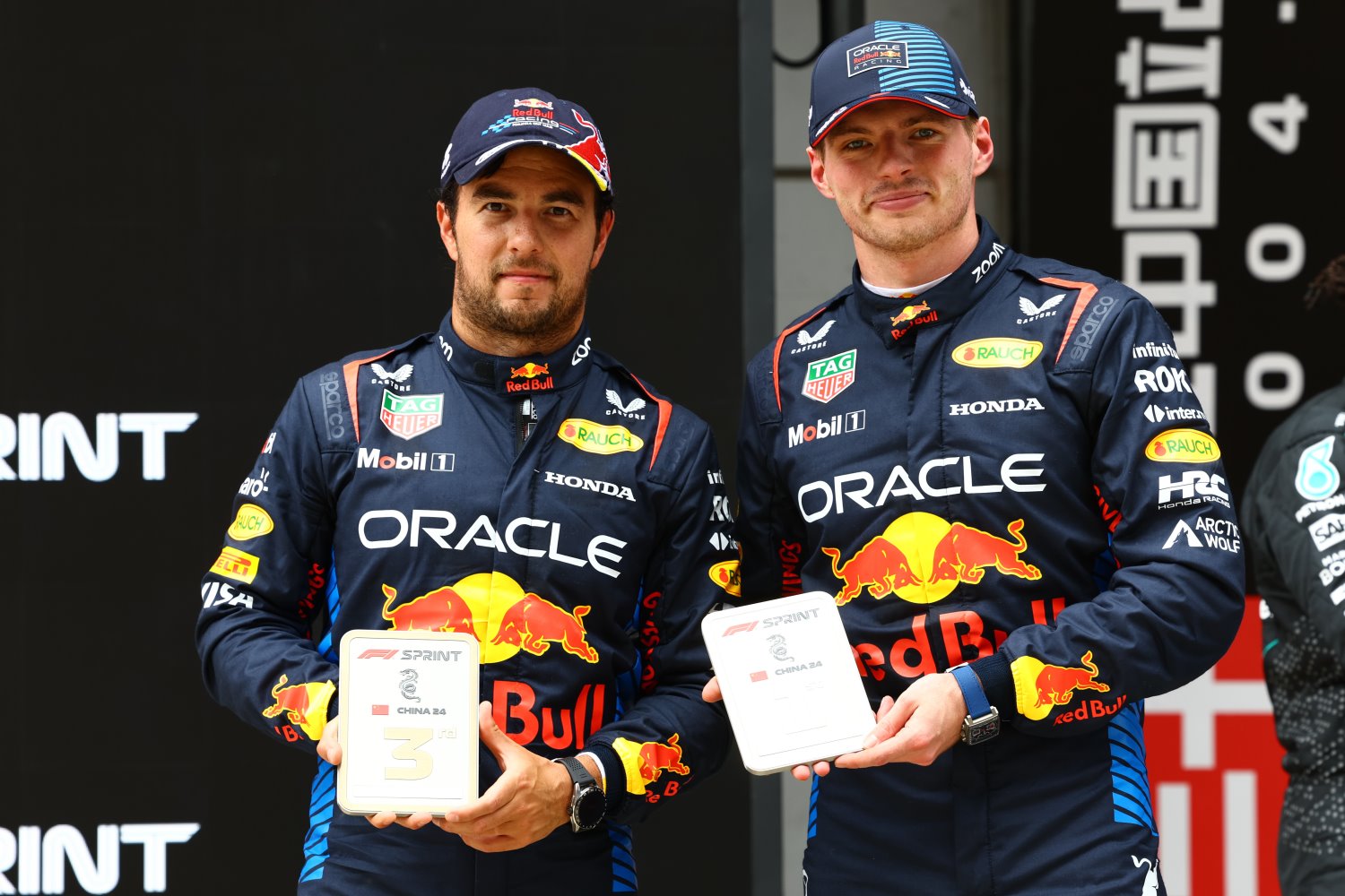 Sprint winner Max Verstappen of the Netherlands and Oracle Red Bull Racing and Third placed Sergio Perez of Mexico and Oracle Red Bull Racing celebrate in parc ferme during the Sprint ahead of the F1 Grand Prix of China at Shanghai International Circuit on April 20, 2024 in Shanghai, China. (Photo by Mark Thompson/Getty Images) // Getty Images / Red Bull Content Pool