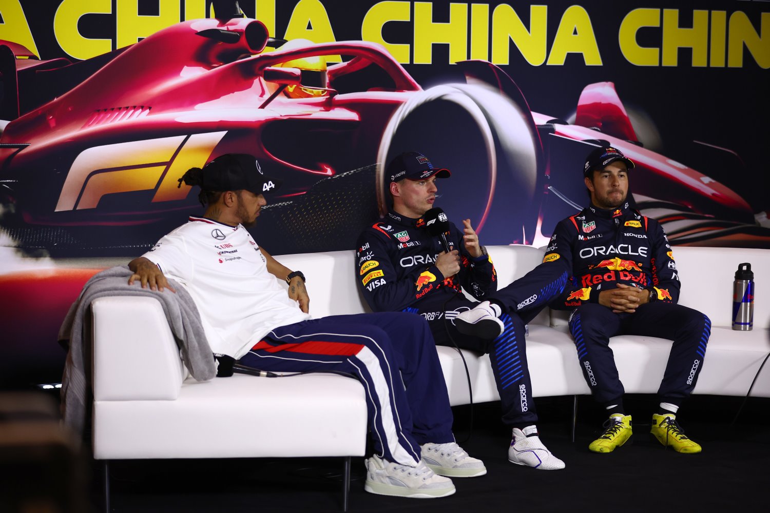 Sprint winner Max Verstappen of the Netherlands and Oracle Red Bull Racing, Second placed Lewis Hamilton of Great Britain and Mercedes and Third placed Sergio Perez of Mexico and Oracle Red Bull Racing attend the press conference after the Sprint ahead of the F1 Grand Prix of China at Shanghai International Circuit on April 20, 2024 in Shanghai, China. (Photo by Bryn Lennon/Getty Images) // Getty Images / Red Bull Content Pool