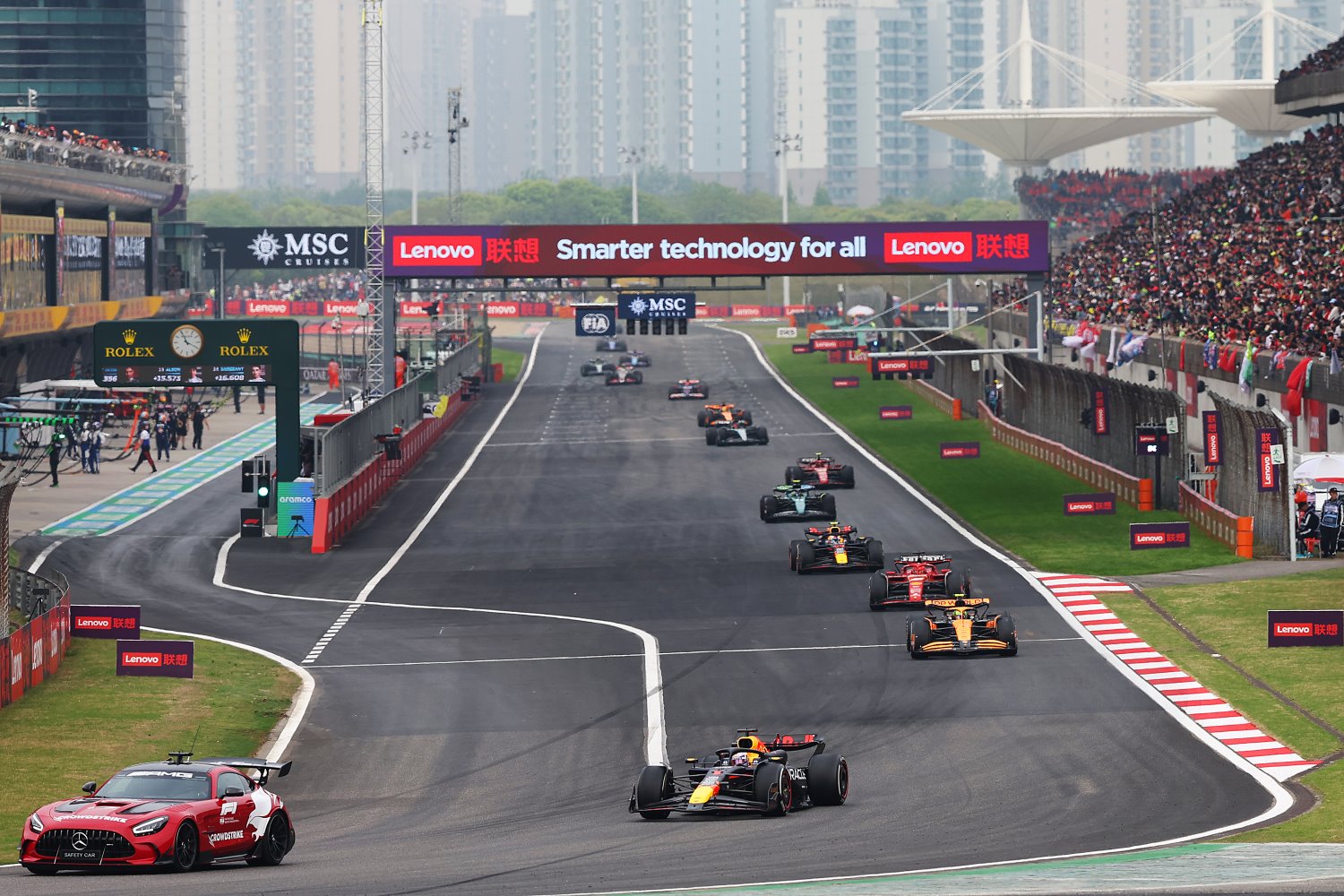 The FIA Safety Car leads Max Verstappen of the Netherlands driving the (1) Oracle Red Bull Racing RB20 on track during the F1 Grand Prix of China at Shanghai International Circuit on April 21, 2024 in Shanghai, China. (Photo by Lintao Zhang/Getty Images ) // Getty Images / Red Bull Content Pool