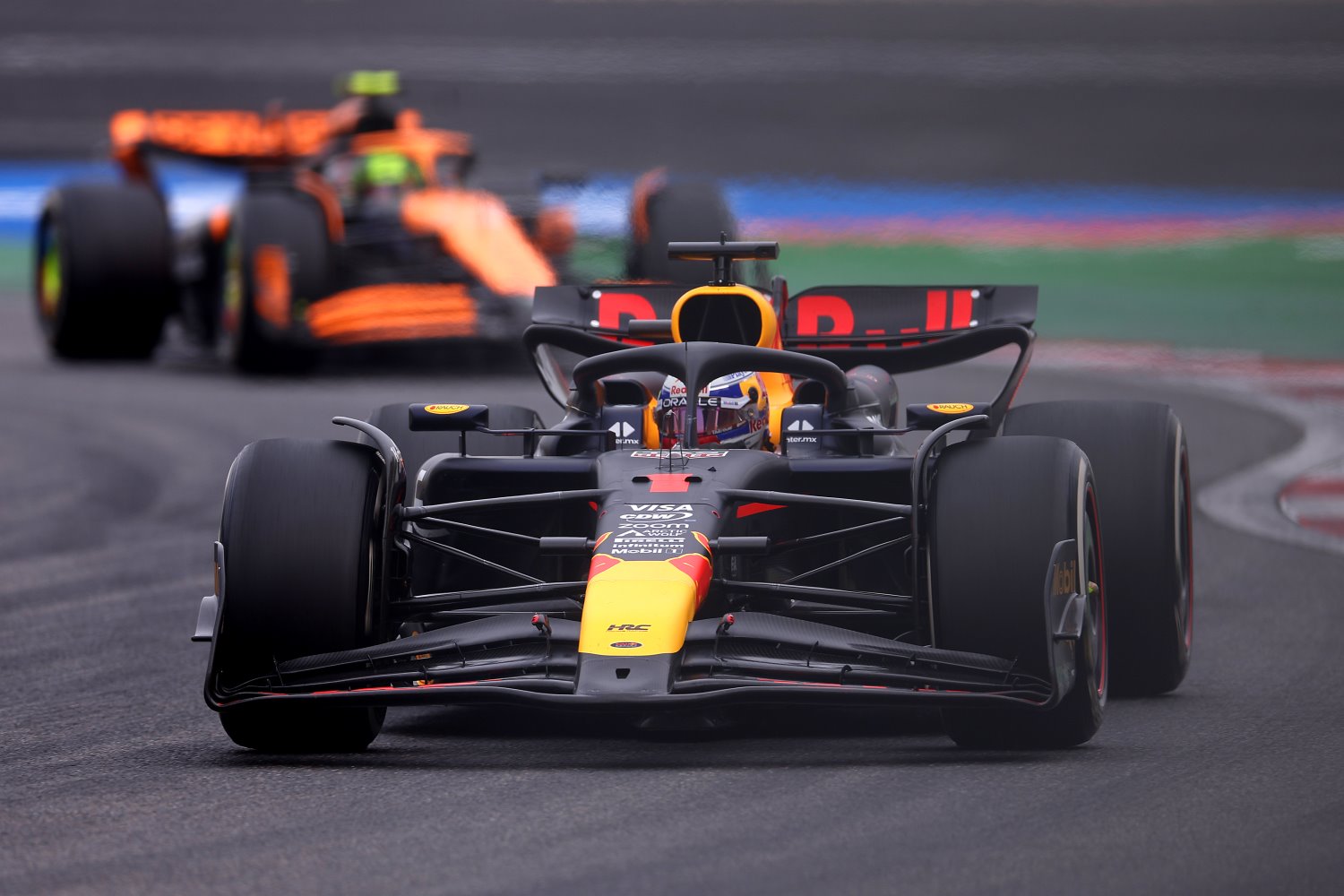 Max Verstappen of the Netherlands driving the (1) Oracle Red Bull Racing RB20 leads Lando Norris of Great Britain driving the (4) McLaren MCL38 Mercedes on track during the F1 Grand Prix of China at Shanghai International Circuit on April 21, 2024 in Shanghai, China. (Photo by Lars Baron/Getty Images) // Getty Images / Red Bull Content Pool