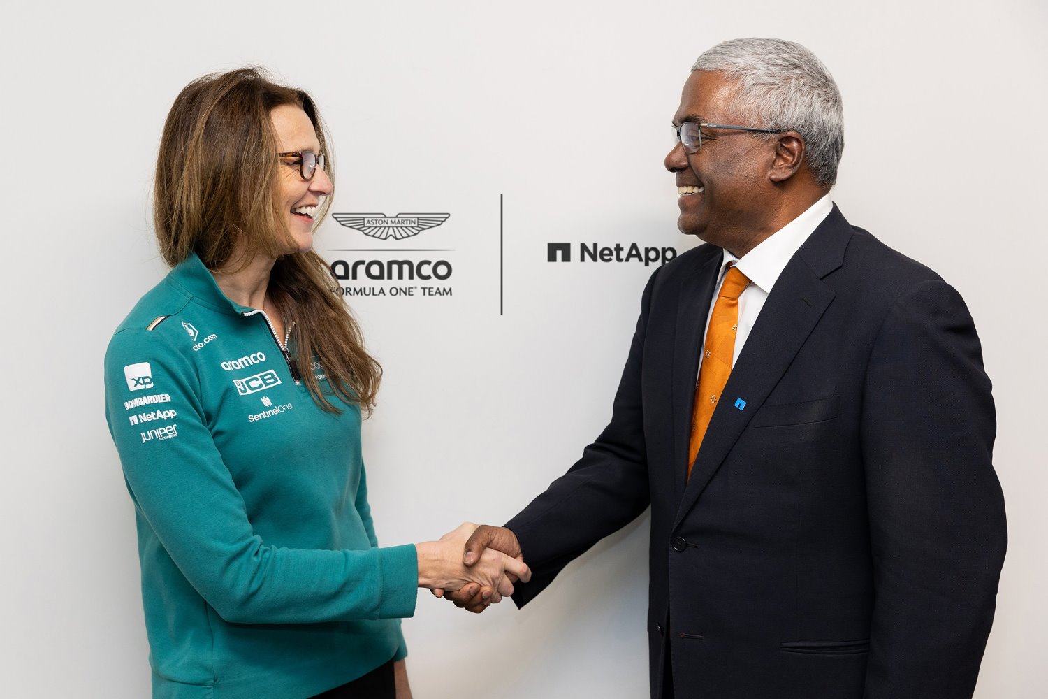 Clare Lansley, Chief Information Officer, Aston Martin Aramco Formula One Team shakes hands with Gabie Boko, Chief Marketing Officer, NetApp