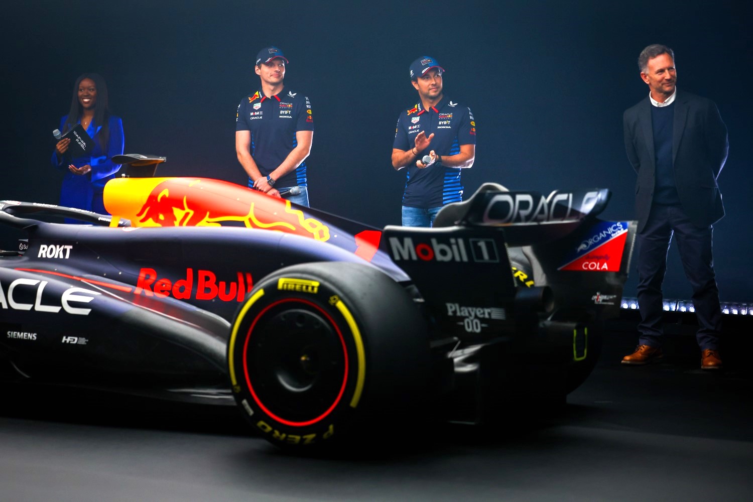 Max Verstappen of the Netherlands and Oracle Red Bull Racing, Sergio Perez of Mexico and Oracle Red Bull Racing and Red Bull Racing Team Principal Christian Horner stand with the RB20 during the Oracle Red Bull Racing RB20 car launch at Red Bull Racing Factory on February 15, 2024 in Milton Keynes, England. (Photo by Mark Thompson/Getty Images for Red Bull Racing)