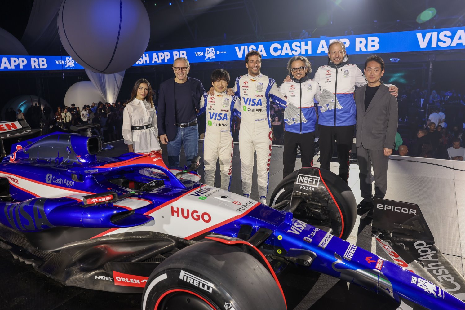 2024 Visa Cash App RB Car Launch in Las Vegas LAS VEGAS, NEVADA - FEBRUARY 08: (L-R) Amna Al Qubaisi of United Arab Emirates and Visa Cash App RB F1 Academy, Stefano Domenicali, CEO of the Formula One Group, Yuki Tsunoda of Japan and Visa Cash App RB, Daniel Ricciardo of Australia and Visa Cash App RB, Laurent Mekies, Team Principal of Visa Cash App RB, Peter Bayer, CEO of Visa Cash App RB and Koji Watanabe, President of HRC pose for a photo at the Visa Cash App RB Livery Launch Event Las Vegas on February 08, 2024 in Las Vegas, Nevada. (Photo by Jesse Grant/Getty Images for Visa Cash App RB) // Getty Images / Red Bull Content Pool