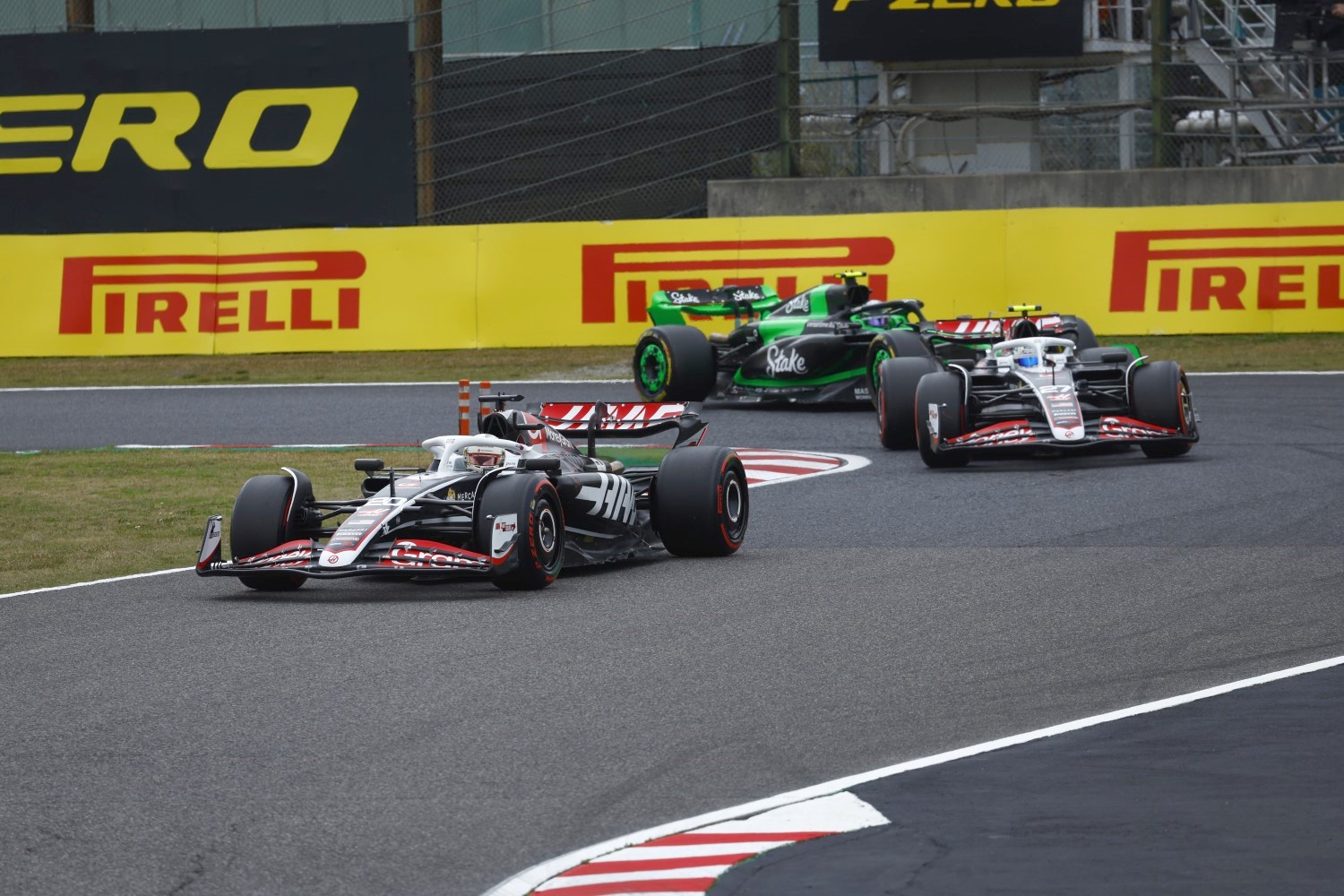 Kevin Magnussen, Haas VF-24, leads Nico Hulkenberg, Haas VF-24, and Zhou Guanyu, Kick Sauber F1 Team C44 during the Japanese GP at Suzuka on Friday April 05, 2024 in Suzuka, Japan. (Photo by Sam Bloxham / LAT Images)