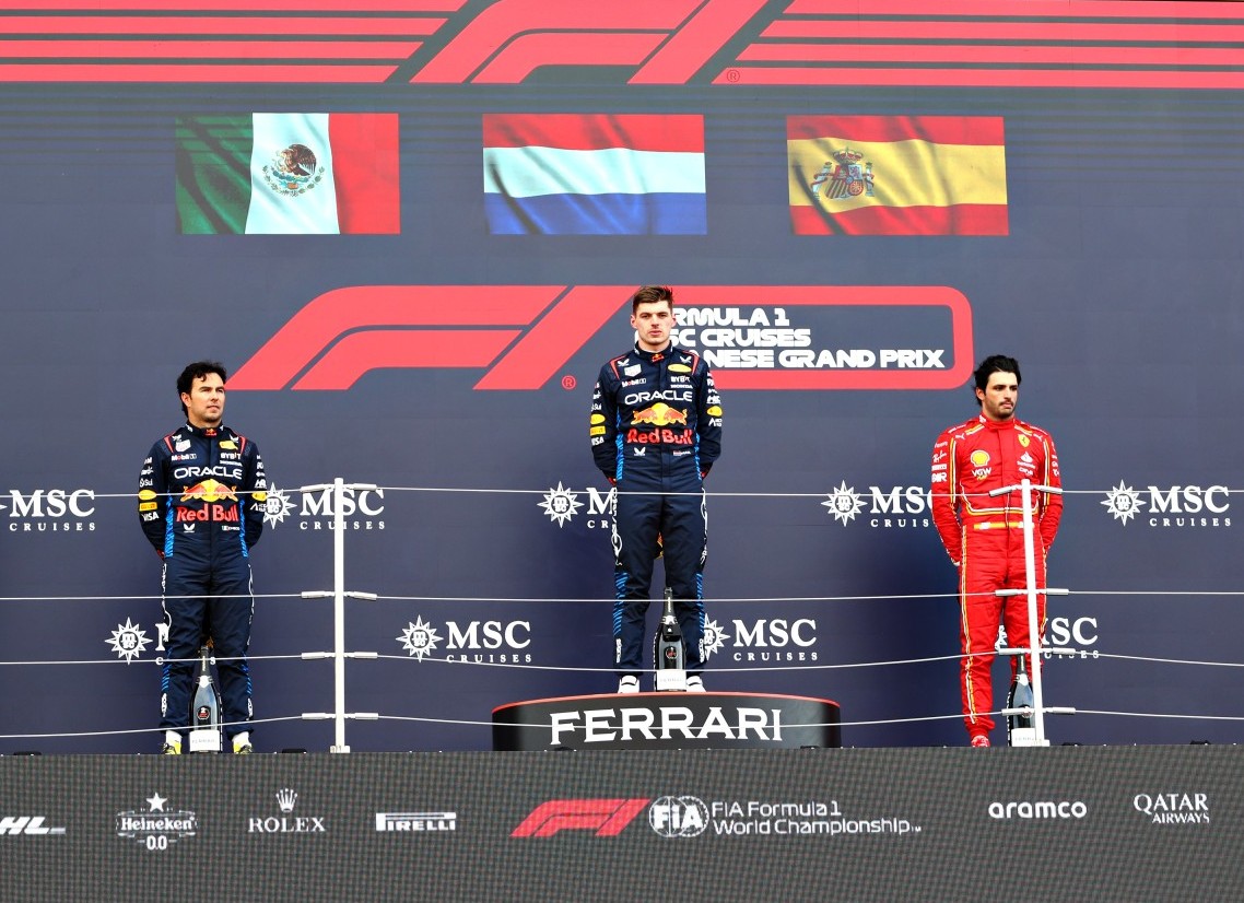 Race winner Max Verstappen of the Netherlands and Oracle Red Bull Racing, Second placed Sergio Perez of Mexico and Oracle Red Bull Racing and Third placed Carlos Sainz of Spain and Ferrari stand on the podium during the F1 Grand Prix of Japan at Suzuka International Racing Course on April 07, 2024 in Suzuka, Japan. (Photo by Peter Fox/Getty Images)