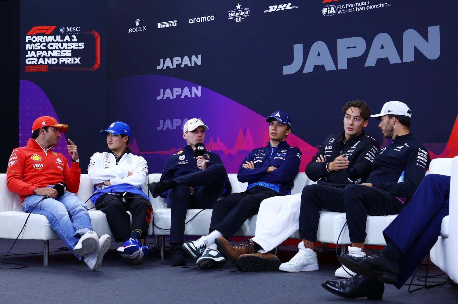 Carlos Sainz of Spain and Ferrari, Yuki Tsunoda of Japan and Visa Cash App RB, Max Verstappen of the Netherlands and Oracle Red Bull Racing, Alexander Albon of Thailand and Williams, George Russell of Great Britain and Mercedes and Pierre Gasly of France and Alpine F1 attend the Drivers Press Conference during previews ahead of the F1 Grand Prix of Japan at Suzuka International Racing Course on April 04, 2024 in Suzuka, Japan. (Photo by Clive Rose/Getty Images) // Getty Images / Red Bull Content Pool