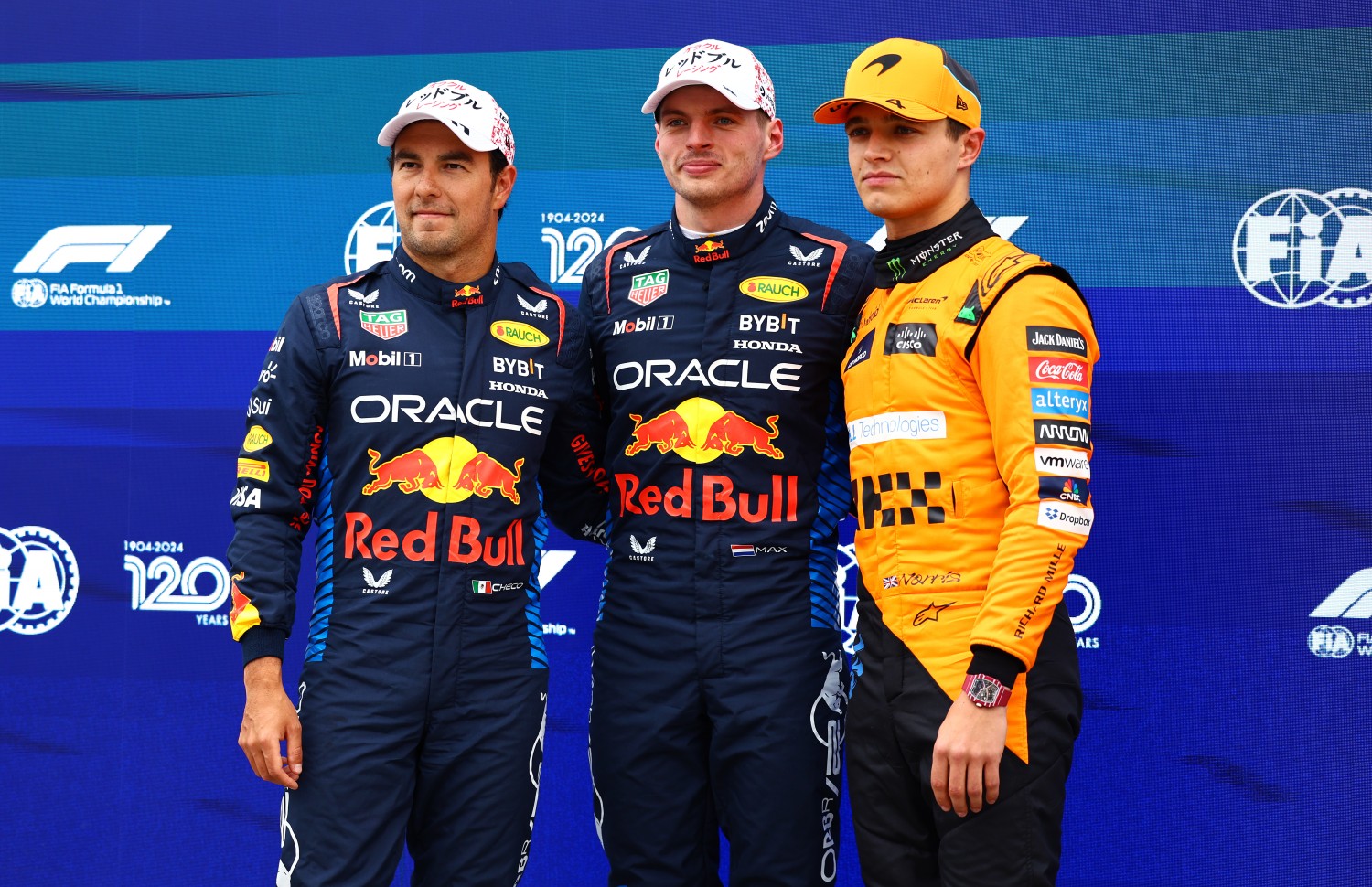 Pole position qualifier Max Verstappen of the Netherlands and Oracle Red Bull Racing (C), Second placed qualifier Sergio Perez of Mexico and Oracle Red Bull Racing (L) and Third placed qualifier Lando Norris of Great Britain and McLaren (R) pose for a photo in parc ferme during qualifying ahead of the F1 Grand Prix of Japan at Suzuka International Racing Course on April 06, 2024 in Suzuka, Japan. (Photo by Mark Thompson/Getty Images)