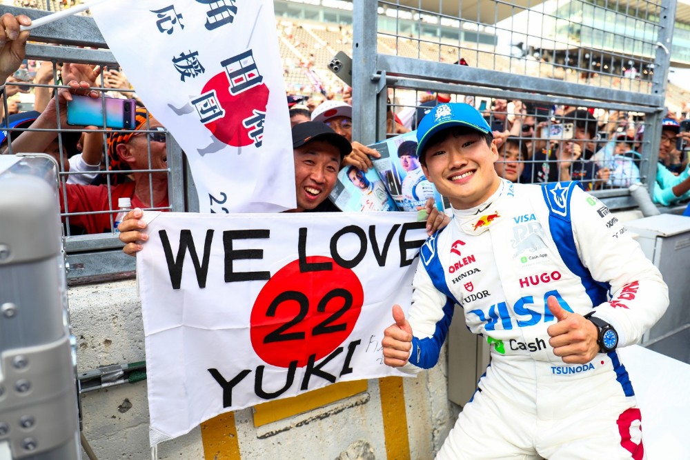 Yuki Tsunoda of Scuderia Visa Cash App RB celebrates finishing in 10th position with the fans during the F1 Grand Prix of Japan at Suzuka International Racing Course on April 07, 2024 in Suzuka, Japan. (Photo by Peter Fox/Getty Images) (Photo by Peter Fox/Getty Images) // Getty Images / Red Bull Content Pool