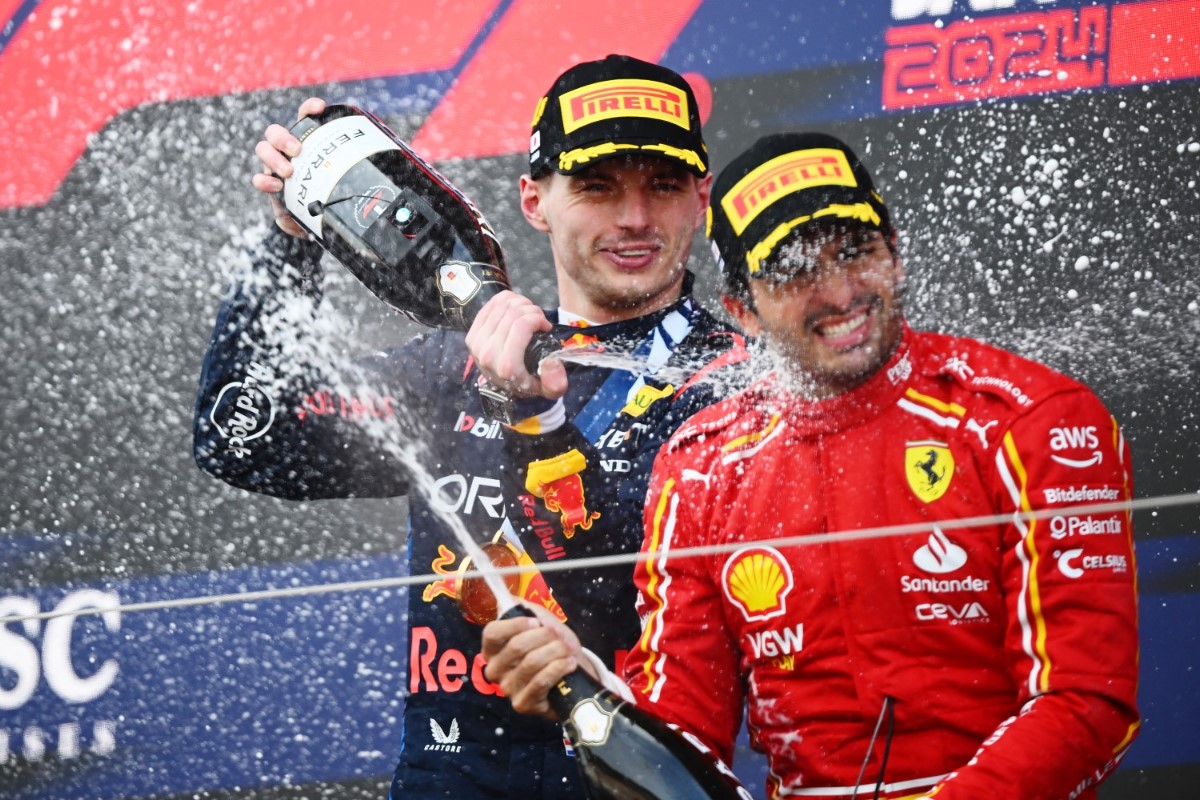 Race winner Max Verstappen of the Netherlands and Oracle Red Bull Racing and Third placed Carlos Sainz Jr. of Spain and Ferrari celebrate on the podium during the F1 Grand Prix of Japan at Suzuka International Racing Course on April 07, 2024 in Suzuka, Japan. (Photo by Clive Mason/Getty Images) // Getty Images / Red Bull Content Pool