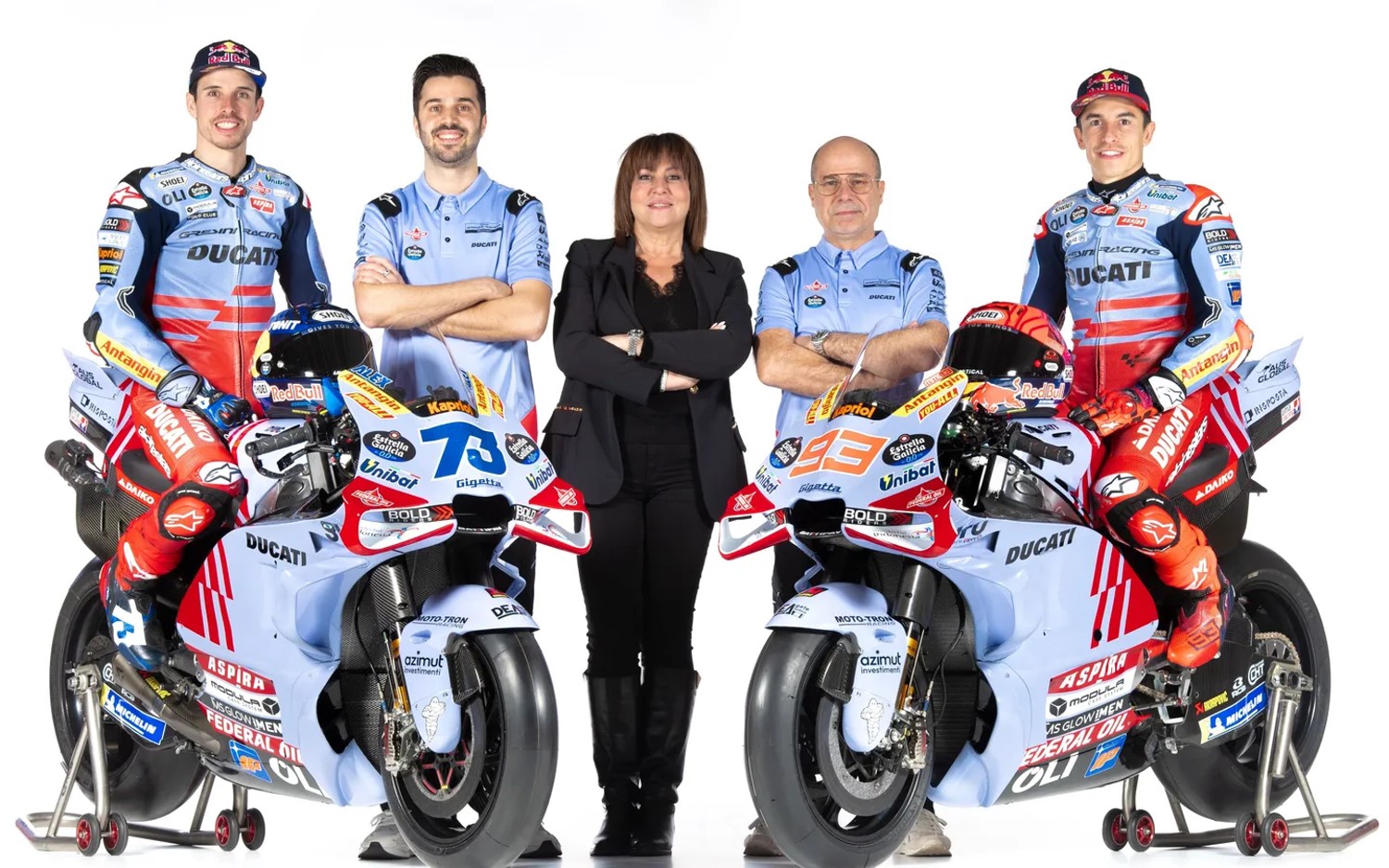 Bothers Marc Marquez and Alex Marquez pose with their Gresini Ducati Desmosedicis and team owner Nadia Padovani. Image: Supplied by Gresini Racing