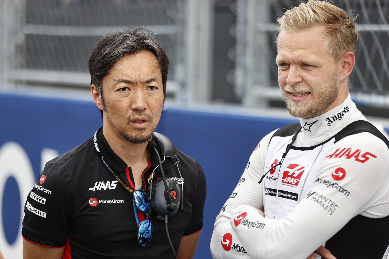 Ayao Komatsu, Chief Engineer, Haas F1 Team, and Kevin Magnussen, Haas F1 Team, on the grid during the Miami GP at Miami International Autodrome on Sunday May 07, 2023 in Miami, United States of America. (Photo by Andy Hone / LAT Images)