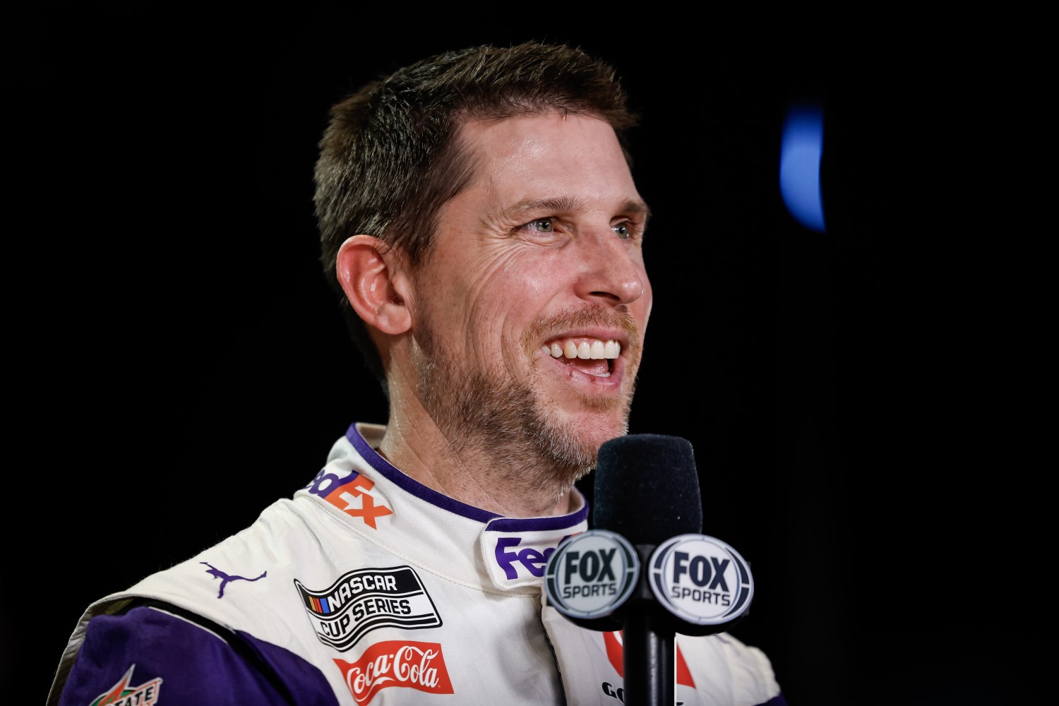 Denny Hamlin speaks to the Media during the NASCAR Cup Series 66th Annual Daytona 500 Media Day at Daytona International Speedway on February 14, 2024 in Daytona Beach, Florida. (Photo by James Gilbert/Getty Images)