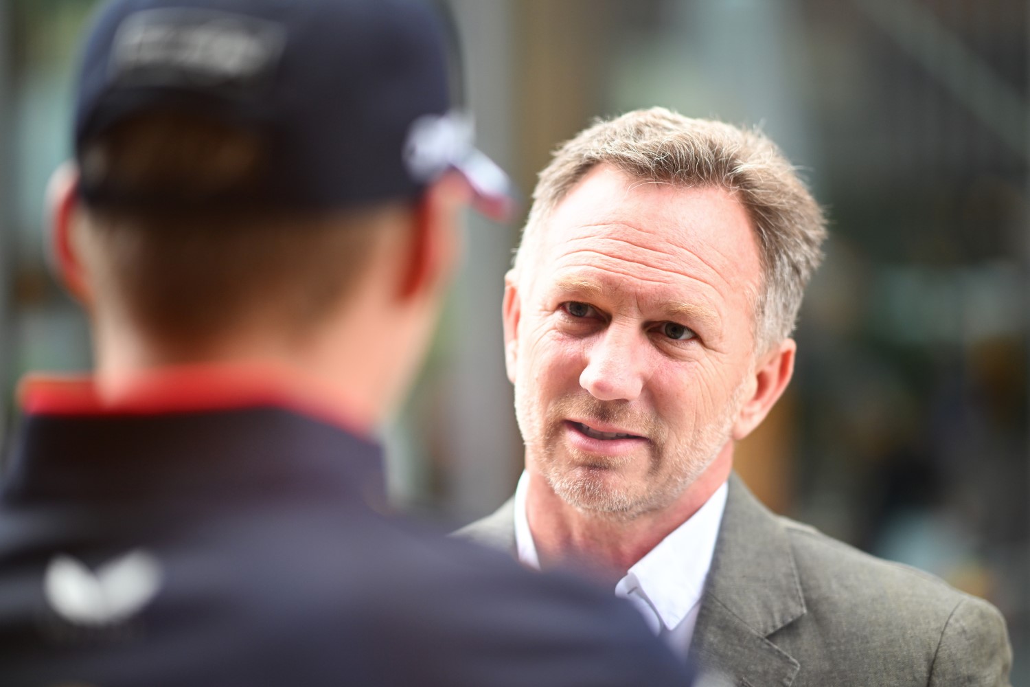 Oracle Red Bull Racing Team Principal Christian Horner talks with Max Verstappen of the Netherlands and Oracle Red Bull Racing in the Paddock during previews ahead of the F1 Grand Prix of Great Britain at Silverstone Circuit on July 04, 2024 in Northampton, England. (Photo by Rudy Carezzevoli/Getty Images) // Getty Images / Red Bull Content Pool