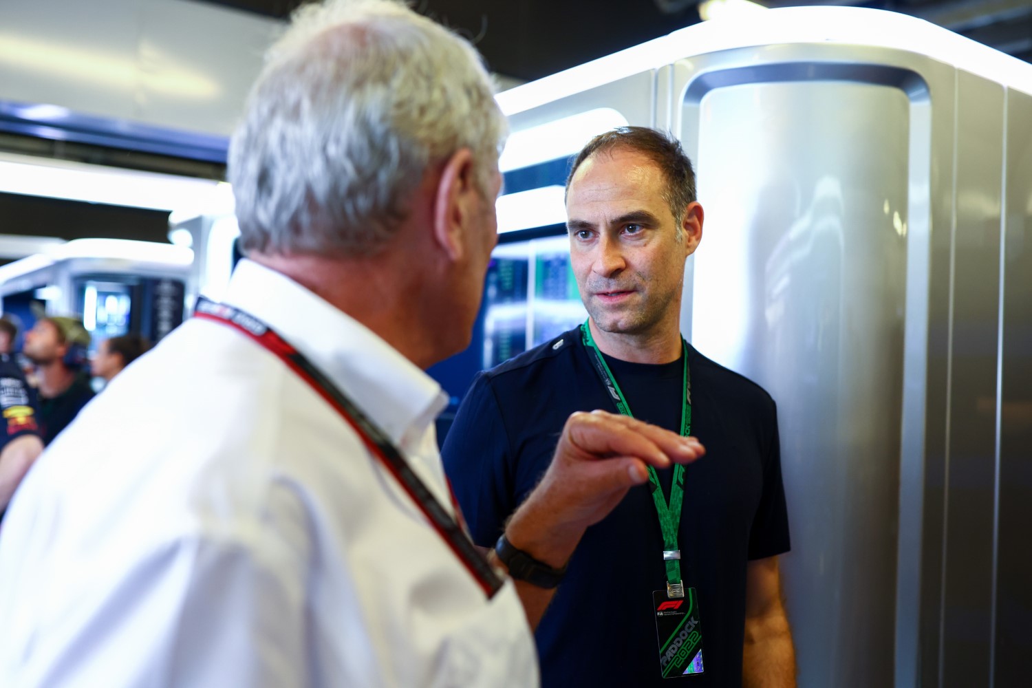 Red Bull Racing Team Consultant Dr Helmut Marko talks with Oliver Mintzlaff, Red Bull Head of Sports in the garage // Getty Images / Red Bull Content Pool