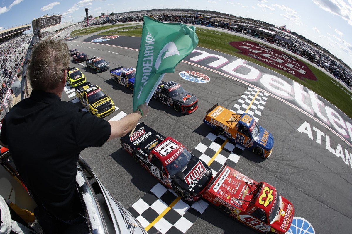 Daniel Dye, driver of the #43 Champion Container Chevrolet, leads Tyler Ankrum, driver of the #18 LiUNA! Chevrolet, and Jack Wood, driver of the #91 Klotz Synthetics Chevrolet, to the green flag to start the NASCAR Craftsman Truck Series Fr8 208 at Atlanta Motor Speedway on February 24, 2024 in Hampton, Georgia. (Photo by Alex Slitz/Getty Images)