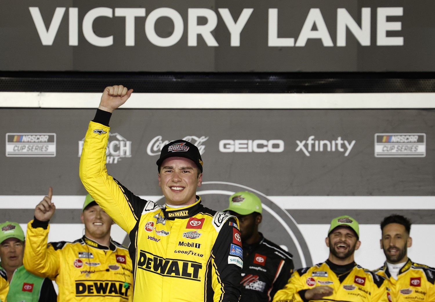 Christopher Bell, driver of the #20 DEWALT/Interstate Batteries Toyota, celebrates in victory lane after winning the NASCAR Cup Series Bluegreen Vacations Duel #2 at Daytona International Speedway on February 15, 2024 in Daytona Beach, Florida. (Photo by Chris Graythen/Getty Images)