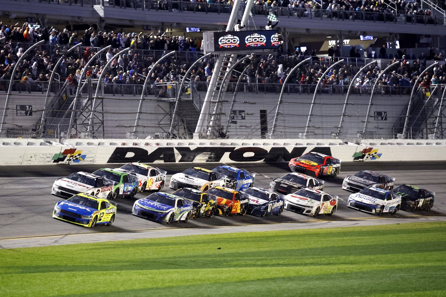 Ryan Blaney, driver of the #12 Menards/PEAK Ford, leads the field during the NASCAR Cup Series Daytona 500 at Daytona International Speedway on February 19, 2024 in Daytona Beach, Florida. (Photo by Chris Graythen/Getty Images)