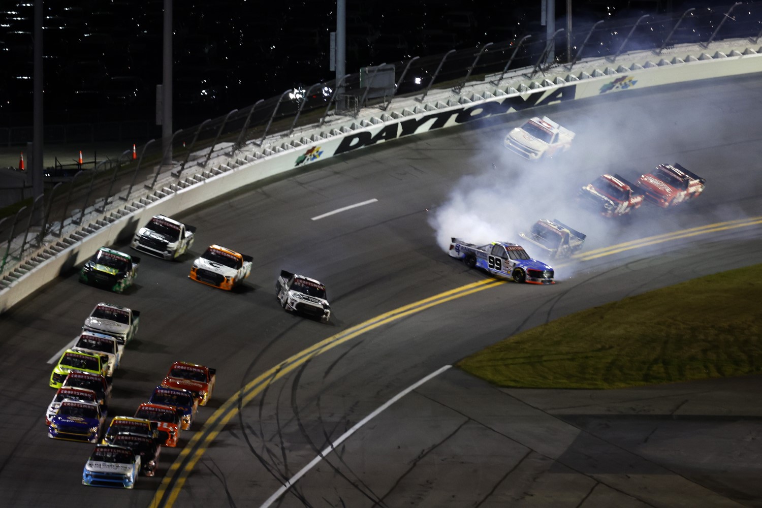 Ben Rhodes, driver of the #99 Ranch Fuel Energy Drink Ford, spins after an on-track incident during the NASCAR Craftsman Truck Series Fresh from Florida 250 at Daytona International Speedway on February 16, 2024 in Daytona Beach, Florida. (Photo by Mike Ehrmann/Getty Images)