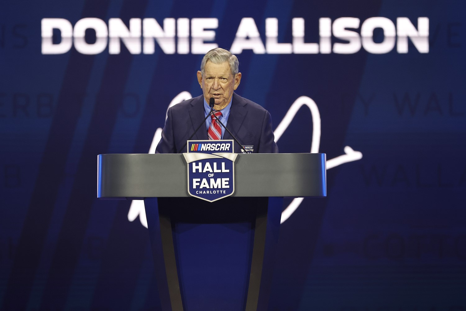 NASCAR Hall of Fame inductee Donnie Allison speaks during the 2024 NASCAR Hall of Fame Induction Ceremony at Charlotte Convention Center on January 19, 2024 in Charlotte, North Carolina. (Photo by Chris Graythen/Getty Images)