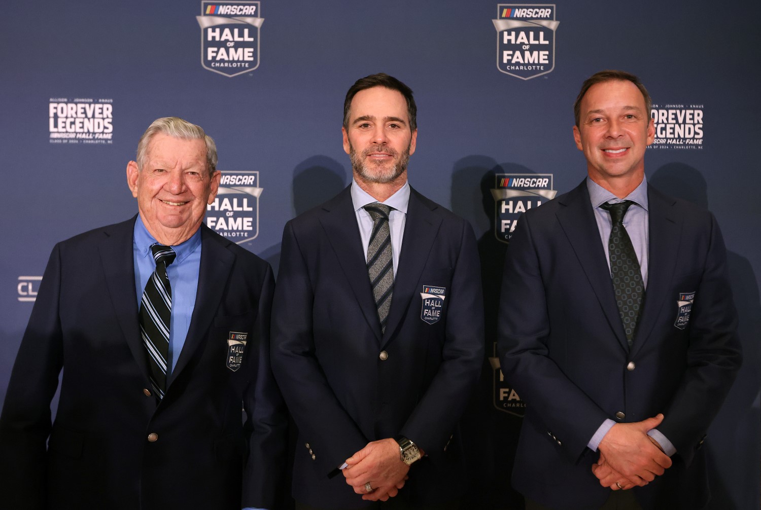 (L-R) NASCAR Hall of Fame inductees Donnie Allison, Jimmie Johnson and Chad Knaus pose for photos during the NHOF Class of 2024 Blue Jacket Ceremony at NASCAR Hall of Fame on January 18, 2024 in Charlotte, North Carolina. (Photo by David Jensen/Getty Images)