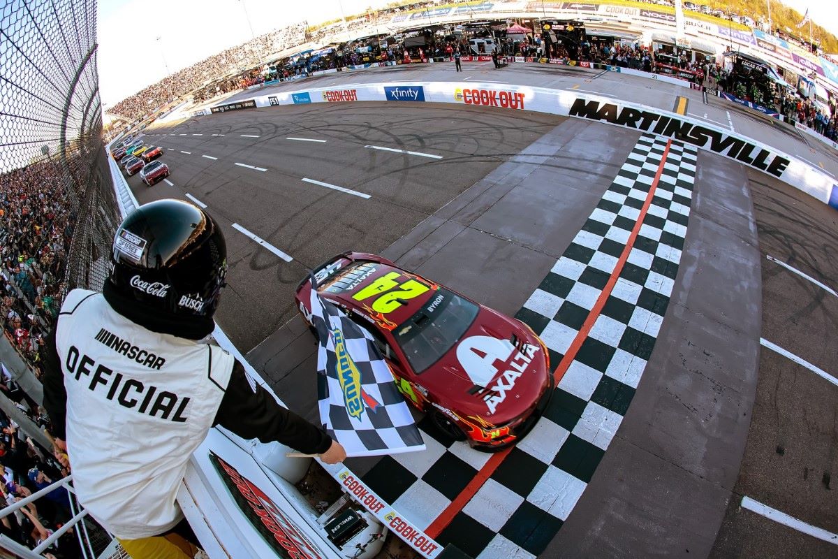 William Byron, driver of the #24 Axalta Ruby Chevrolet, takes the checkered flag to win the NASCAR Cup Series Cook Out 400 at Martinsville Speedway on April 07, 2024 in Martinsville, Virginia. (Photo by James Gilbert/Getty Images)