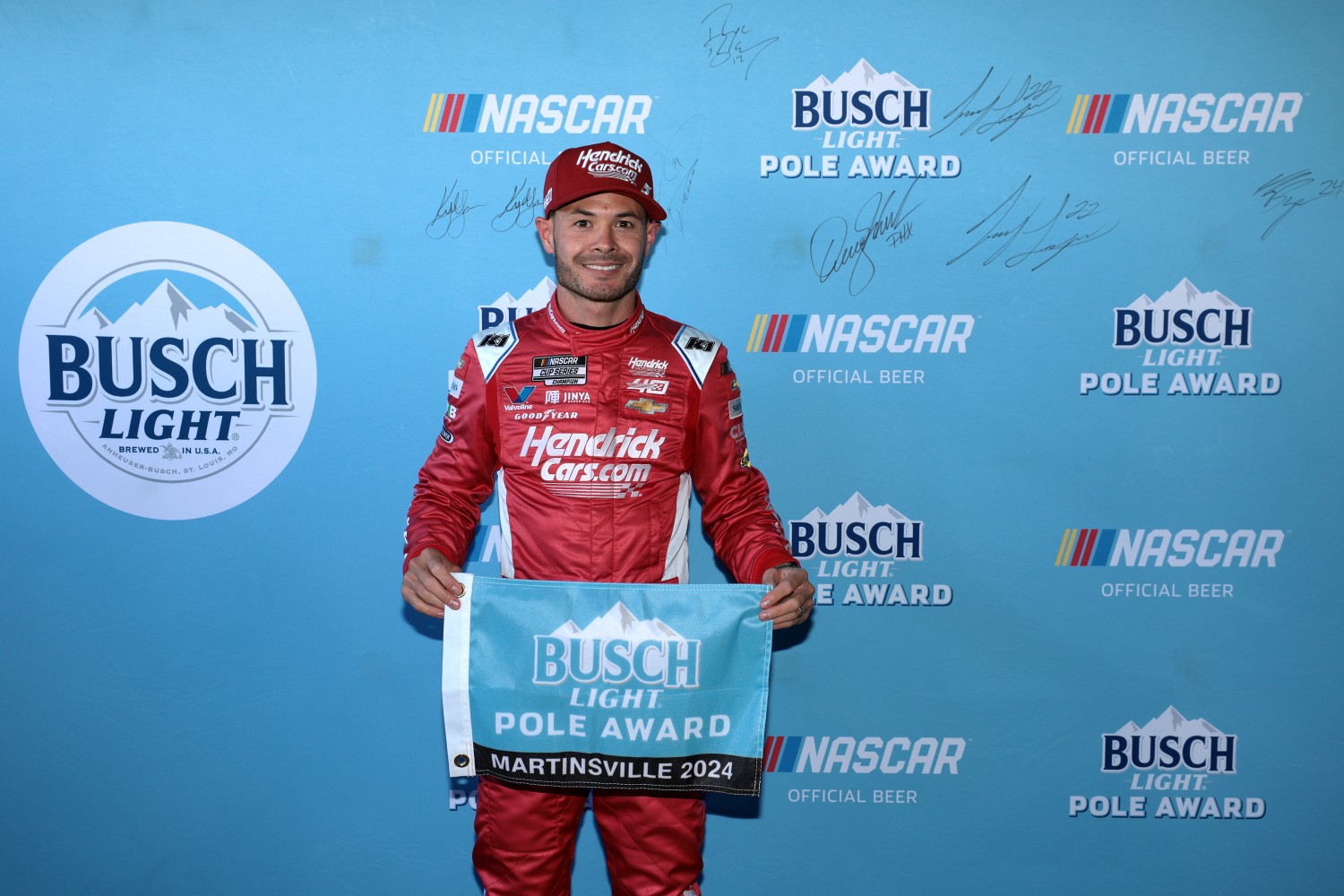 Kyle Larson, driver of the #5 HendrickCars.com Ruby Chevrolet, poses for photos after winning the pole award during qualifying for the NASCAR Cup Series Cook Out 400 at Martinsville Speedway on April 06, 2024 in Martinsville, Virginia. (Photo by James Gilbert/Getty Images)