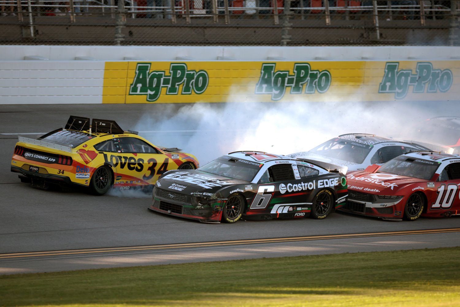 Michael McDowell, driver of the #34 Love's Travel Stops Ford, spins after an on-track incident on the final lap of the NASCAR Cup Series GEICO 500 at Talladega Superspeedway on April 21, 2024 in Talladega, Alabama. (Photo by James Gilbert/Getty Images)