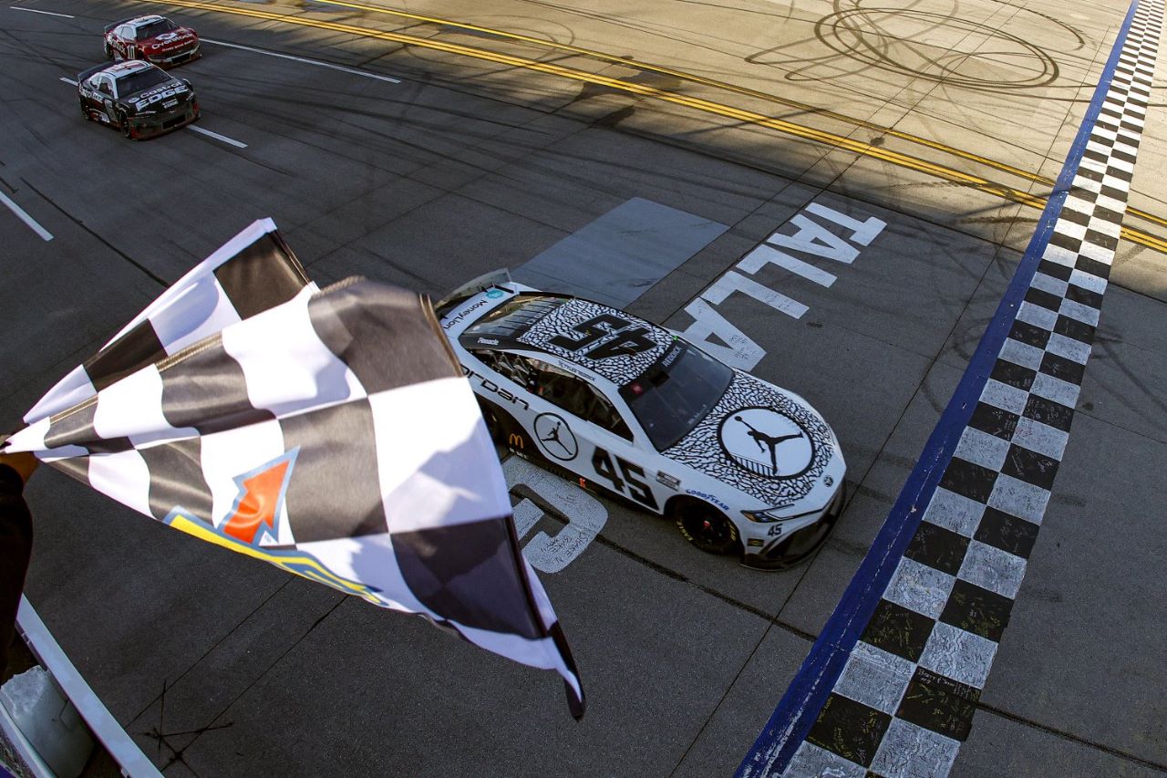 Tyler Reddick, driver of the #45 Jordan Brand Toyota, takes the checkered flag to win the NASCAR Cup Series GEICO 500 at Talladega Superspeedway on April 21, 2024 in Talladega, Alabama. (Photo by Sean Gardner/Getty Images)