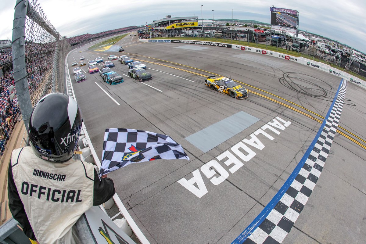 Jesse Love, driver of the #2 WAT Chevrolet, takes the checkered flag to win the NASCAR Xfinity Series Ag-Pro 300 at Talladega Superspeedway on April 20, 2024 in Talladega, Alabama. (Photo by James Gilbert/Getty Images for NASCAR)
