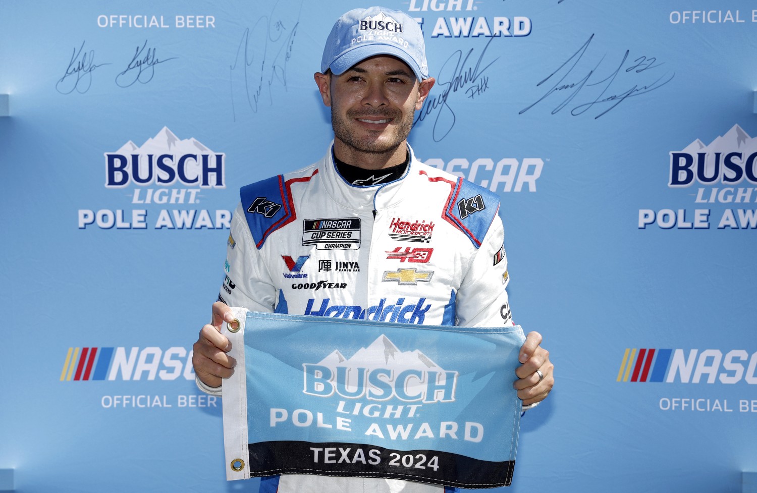 Kyle Larson, driver of the #5 HendrickCars.com Chevrolet, poses for photos after winning the pole award during qualifying for the NASCAR Cup Series AutoTrader EchoPark Automotive 400 at Texas Motor Speedway on April 13, 2024 in Fort Worth, Texas. (Photo by Sean Gardner/Getty Images)