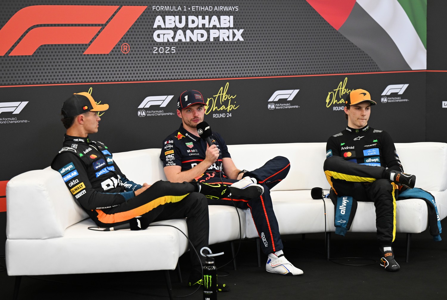 Pole position qualifier Max Verstappen of the Netherlands and Oracle Red Bull Racing Second placed qualifier Lando Norris of Great Britain and McLaren and Third placed qualifier Oscar Piastri of Australia and McLaren in the Drivers Press Conference during qualifying ahead of the F1 Grand Prix of Abu Dhabi at Yas Marina Circuit on December 06, 2025 in Abu Dhabi, United Arab Emirates. (Photo by Sam Bagnall/Sutton Images) // Getty Images / Red Bull Content Pool //