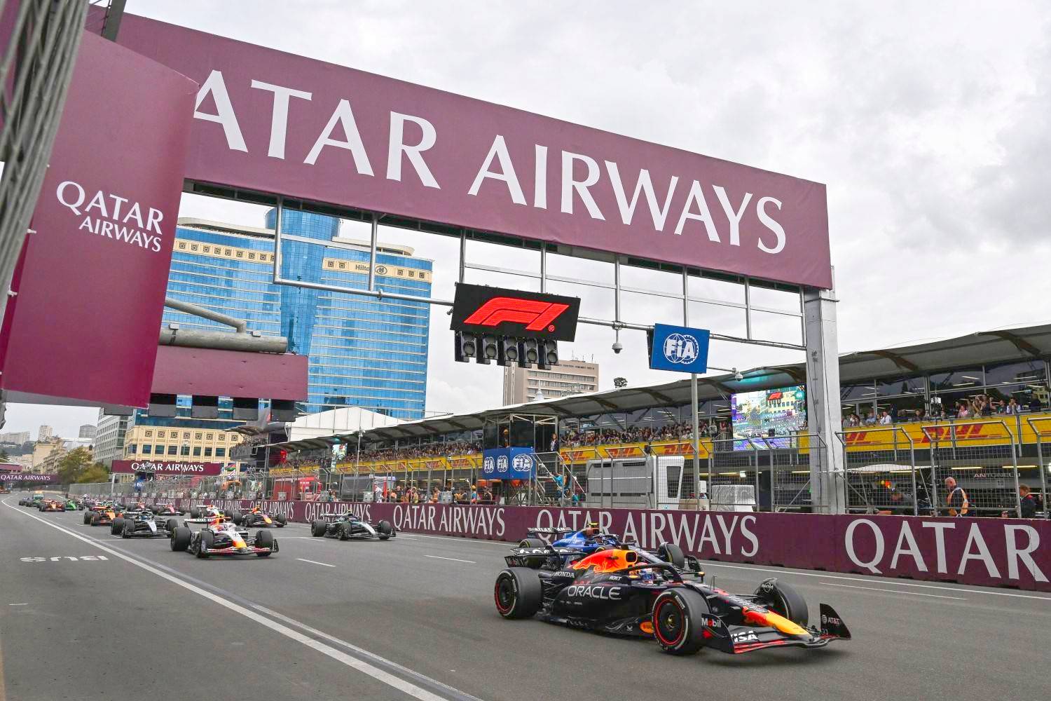 Max Verstappen of the Netherlands driving the (1) Oracle Red Bull Racing RB21 leads Carlos Sainz of Spain driving the (55) Williams FW47 Mercedes, Liam Lawson of New Zealand driving the (30) Visa Cash App Racing Bulls VCARB 02 and the rest of the pack at the start during the F1 Grand Prix of Azerbaijan at Baku City Circuit on September 21, 2025 in Baku, Azerbaijan. (Photo by Michael Potts/LAT Images) // Getty Images / Red Bull Content Pool //
