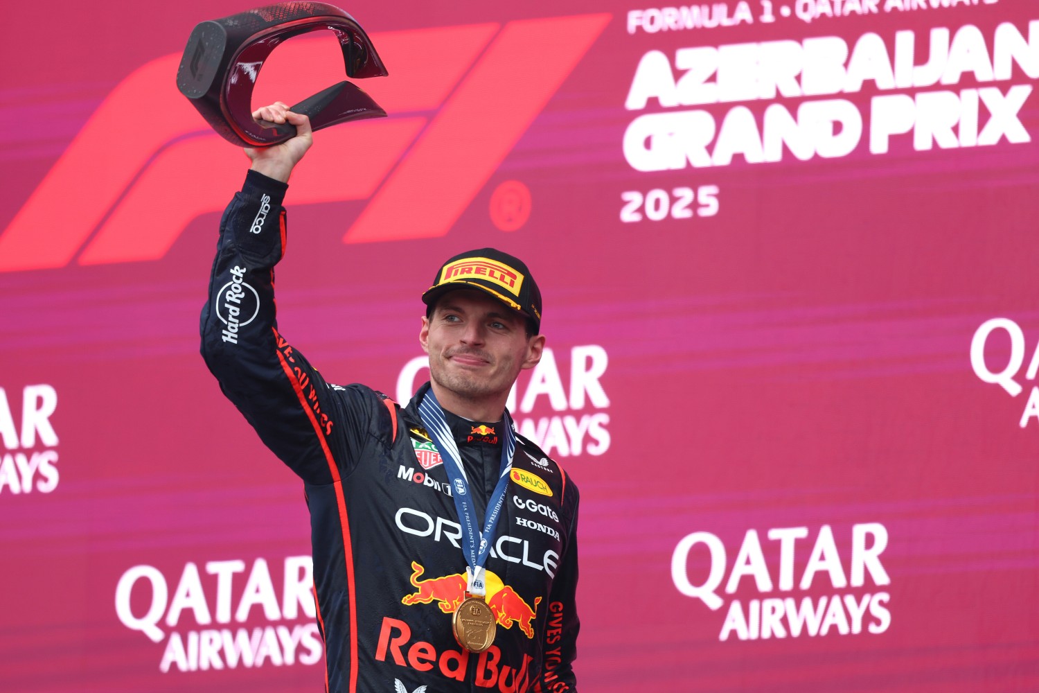 Race winner Max Verstappen of the Netherlands and Oracle Red Bull Racing lifts his trophy on the podium during the F1 Grand Prix of Azerbaijan at Baku City Circuit on September 21, 2025 in Baku, Azerbaijan. (Photo by Andy Hone/LAT Images) // Getty Images / Red Bull Content Pool //