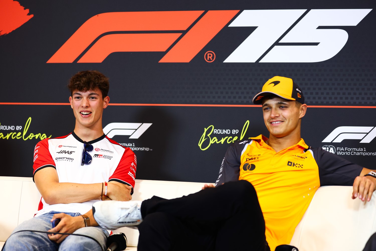 Oliver Bearman of Great Britain and Haas F1 and Lando Norris of Great Britain and McLaren look on in the Drivers Press Conference during previews ahead of the F1 GP of Spain at Circuit de Barcelona-Catalunya on May 29, 2025 in Barcelona, Spain. (Photo by Clive Rose/Getty Images)