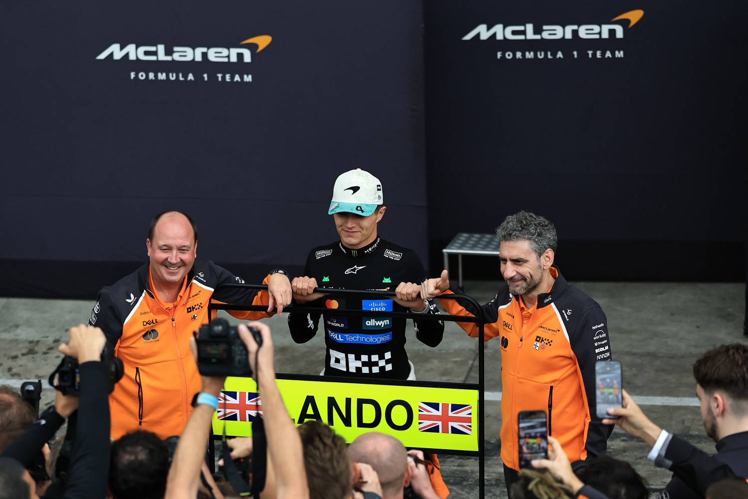Race winner Lando Norris of Great Britain and McLaren Andrea Stella, Team Principal of McLaren Mark Norris, Director of Commercial Trackside Operations at McLaren and the McLaren team celebrate during the F1 Grand Prix of Brazil at Autodromo Jose Carlos Pace on November 09, 2025 in Sao Paulo, Brazil. (Photo by Buda Mendes/Getty Images for McLaren)