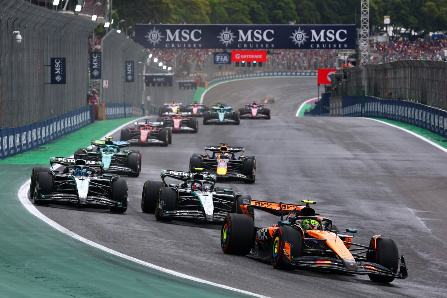 Lando Norris of Great Britain driving the (4) McLaren MCL39 Mercedes leads Andrea Kimi Antonelli of Italy driving the (12) Mercedes AMG Petronas F1 Team W16 George Russell of Great Britain driving the (63) Mercedes AMG Petronas F1 Team W16 and the rest of the field at the restart during the Sprint ahead of the F1 Grand Prix of Brazil at Autodromo Jose Carlos Pace on November 08, 2025 in Sao Paulo, Brazil. (Photo by Mark Thompson/Getty Images)