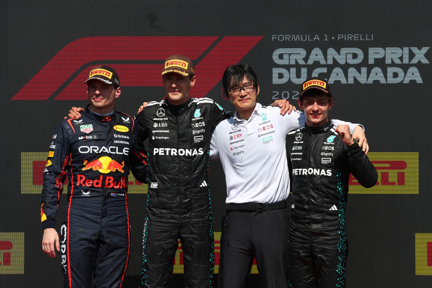 Race winner George Russell of Great Britain and Mercedes AMG Petronas F1 Team, Second placed Max Verstappen of the Netherlands and Oracle Red Bull Racing and Third placed Andrea Kimi Antonelli of Italy and Mercedes AMG Petronas F1 Team with the Mercedes AMG Petronas F1 Team trophy delegate on the podium during the F1 Grand Prix of Canada at Circuit Gilles-Villeneuve on June 15, 2025 in Montreal, Quebec. (Photo by Clive Rose/Getty Images) // Getty Images / Red Bull Content Pool //