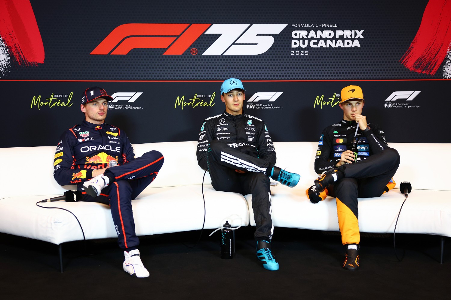 Pole position qualifier George Russell of Great Britain and Mercedes AMG Petronas F1 Team Second placed qualifier Max Verstappen of the Netherlands and Oracle Red Bull Racing and Third placed qualifier Oscar Piastri of Australia and McLaren in the Drivers Press Conference during qualifying ahead of the F1 GP of Canada at Circuit Gilles-Villeneuve on June 14, 2025 in Montreal, Quebec. (Photo by Clive Rose/Getty Images) // Getty Images / Red Bull Content Pool //