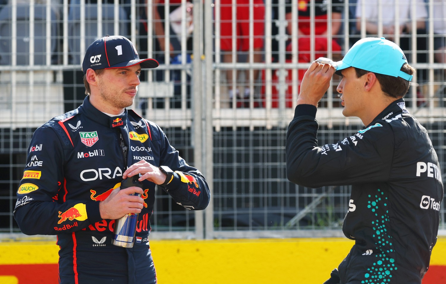 Pole position qualifier George Russell of Great Britain and Mercedes AMG Petronas F1 Team talks with Second placed qualifier Max Verstappen of the Netherlands and Oracle Red Bull Racing in parc ferme during qualifying ahead of the F1 Grand Prix of Canada at Circuit Gilles-Villeneuve on June 14, 2025 in Montreal, Quebec. (Photo by Mark Thompson/Getty Images) // Getty Images / Red Bull Content Pool //
