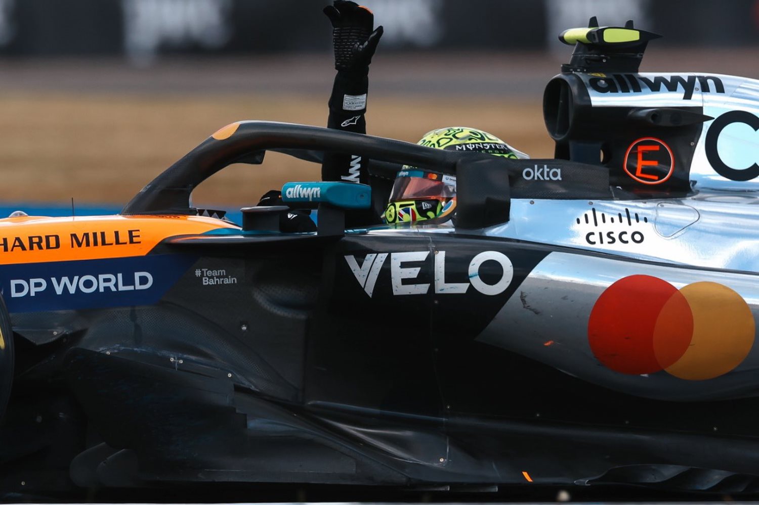 2025 British GP winner Lando Norris waves to the crowd.
