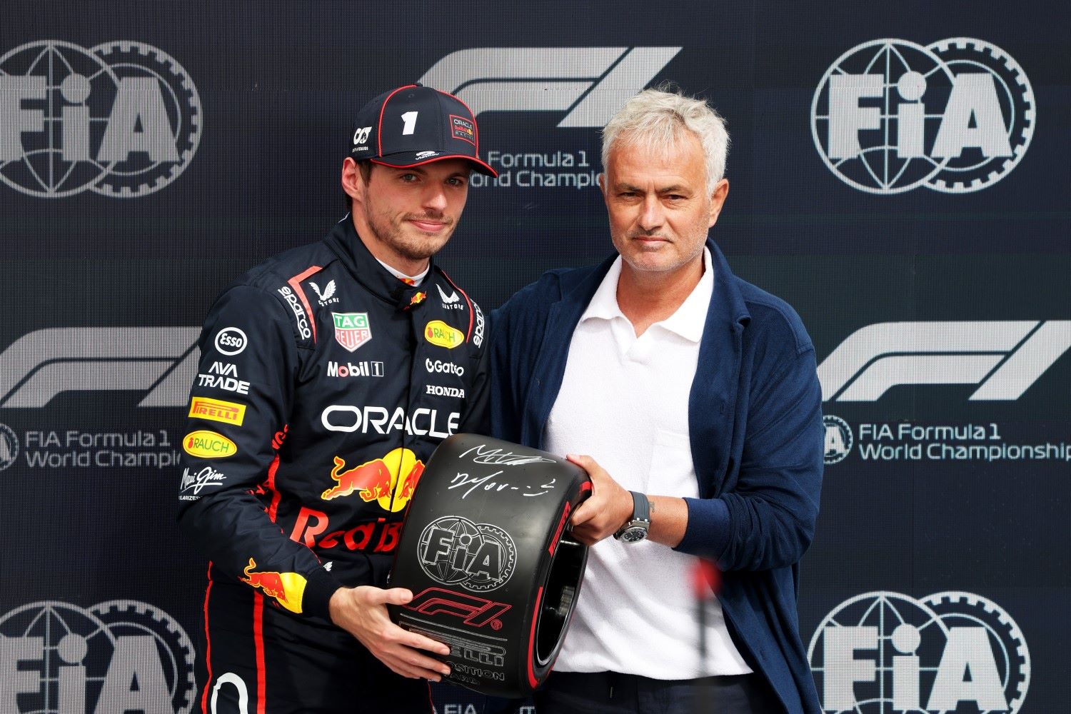 Pole position qualifier Max Verstappen of the Netherlands and Oracle Red Bull Racing is presented with the Pirelli Pole Position award by Jose Mourinho during qualifying ahead of the F1 Grand Prix of Great Britain at Silverstone Circuit on July 05, 2025 in Northampton, England. (Photo by Sam Bloxham/LAT Images for Red Bull)