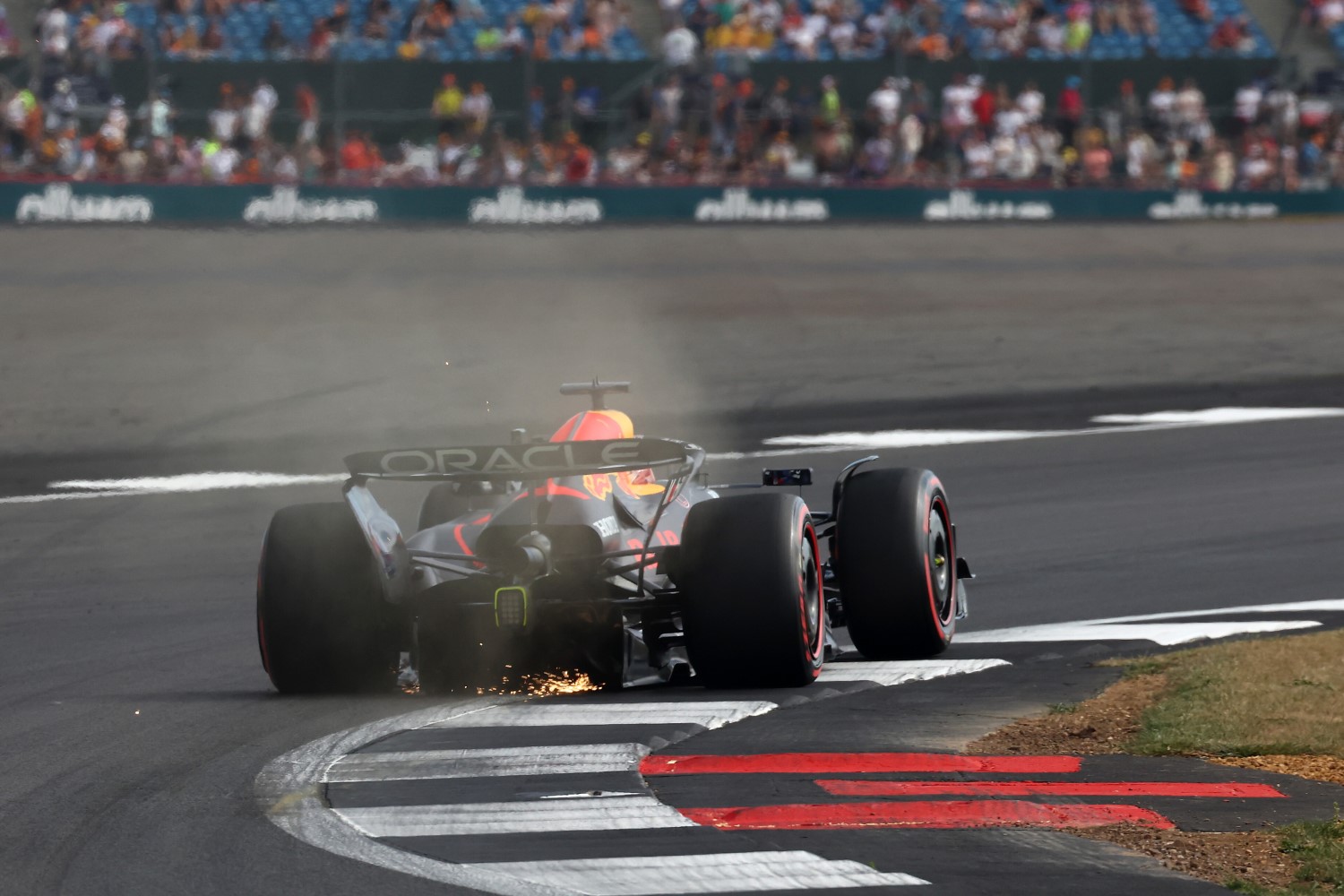 Sparks fly behind Max Verstappen of the Netherlands driving the (1) Oracle Red Bull Racing RB21 on track during qualifying ahead of the F1 Grand Prix of Great Britain at Silverstone Circuit on July 05, 2025 in Northampton, England. (Photo by Colin McMaster/LAT Images) // Getty Images / Red Bull Content Pool //